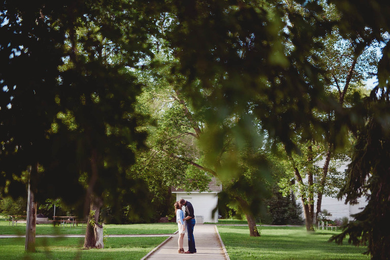 engaged couple kisses at John Walter Museum