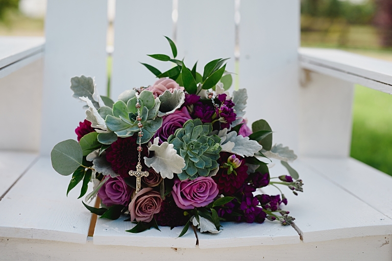 Gorgeous photography of a Laurel's on Whyte with purple flowers and succulents in the bride's chair prior to her Edmonton Wedding.